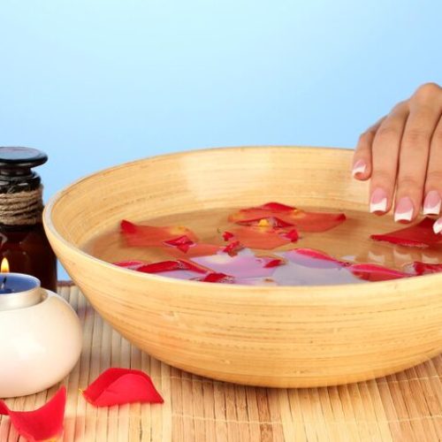 spa-treatments-female-hands-blue-background_392895-94640